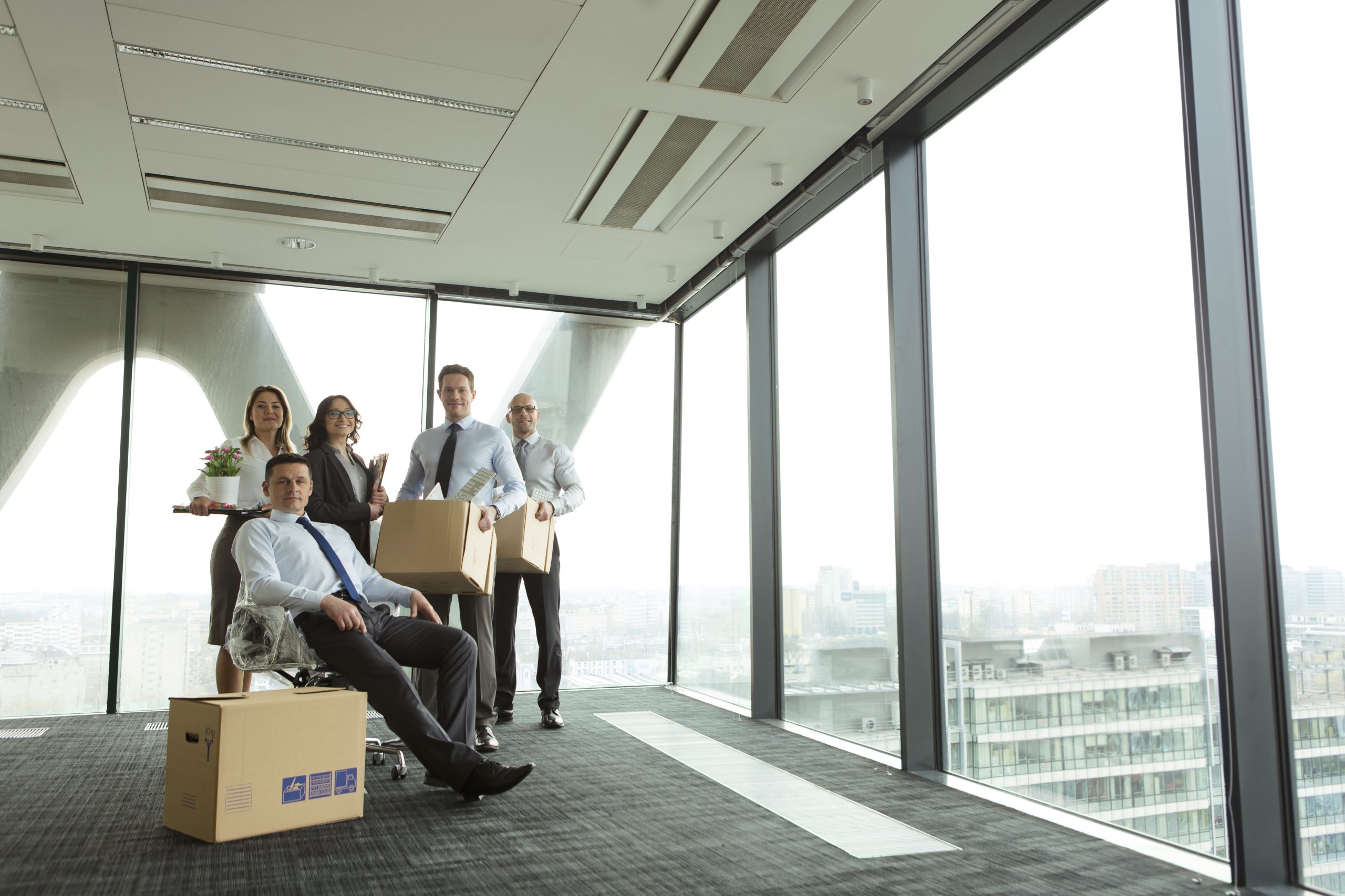 Businesspeople moving into new office