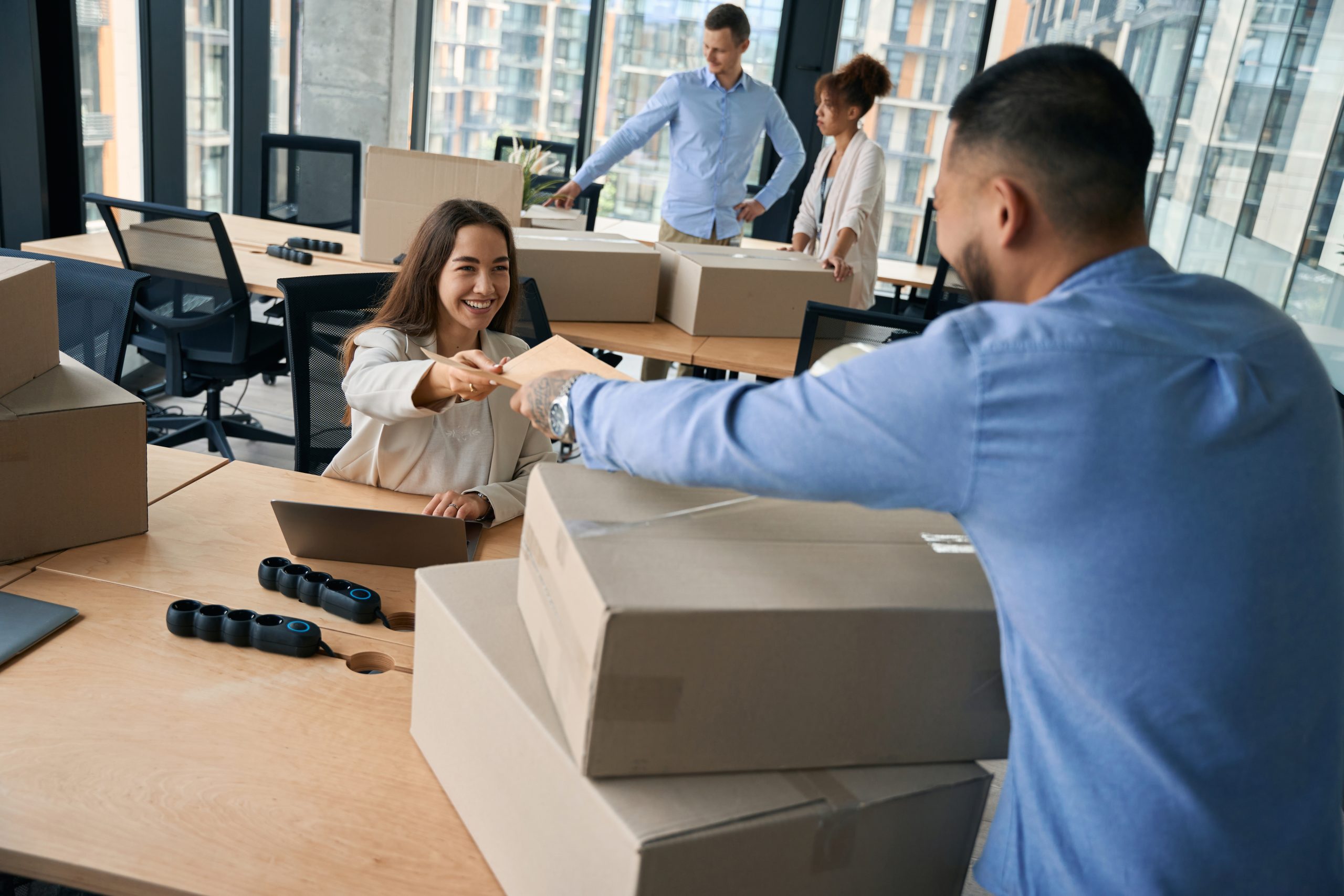Group of corporate employees involved in office move